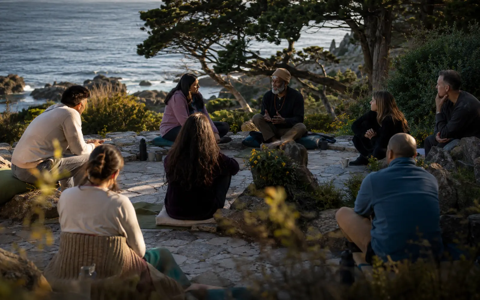 A real gathering in a beautiful nature-connected place, with authentic participation, emotional safety and understated wonder rather than staged wellness imagery.
