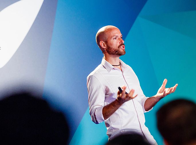 Prof. Matt Riemann speaking on stage